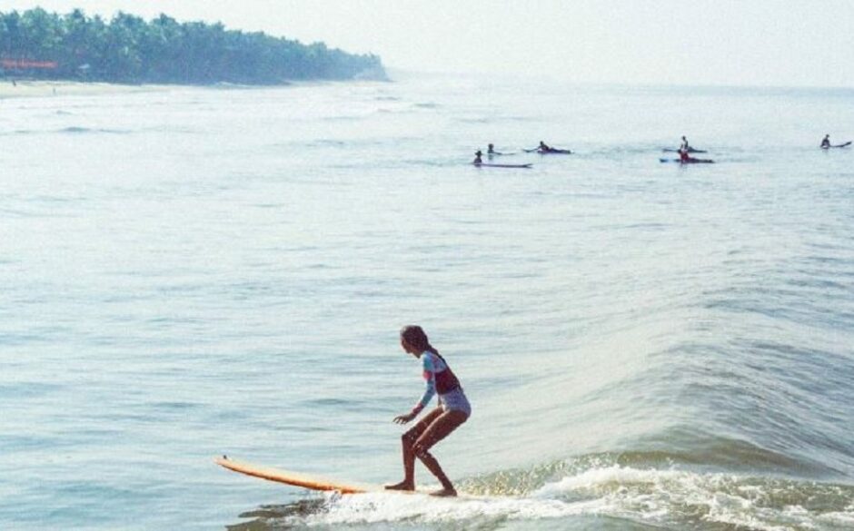 The famous Indian surfer Ishita Malaviya riding a wave in Karnataka