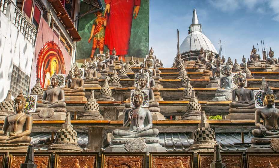 Statues of Buddha in Gangaramaya Buddhist Temple, Colombo, Sri Lanka