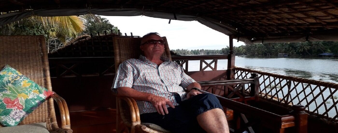 Client Phil relaxing aboard a houseboat in Kerala