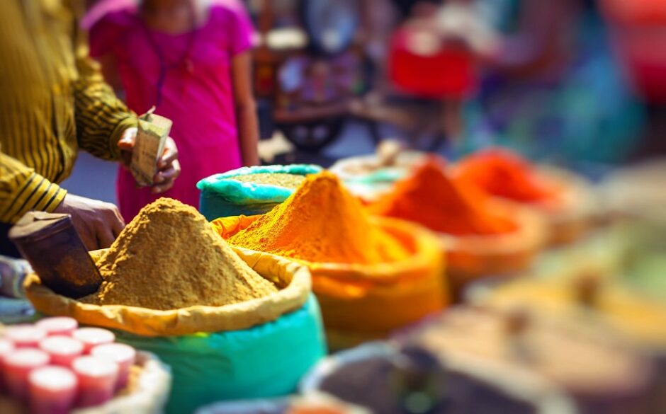 Colorful spices powders and herbs in traditional street market in Delhi