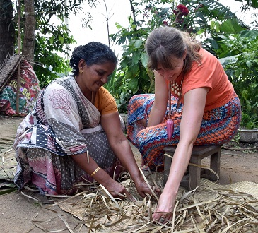 Client trying coconut leaf weaving