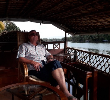 Client Phil relaxing aboard a houseboat in Kerala