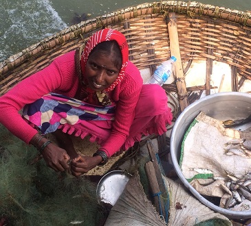 Woman in pink on a fishing boat