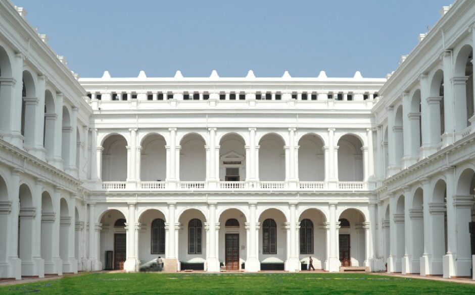 Exterior of the Indian Museum, Kolkata. It is a palacial looking building with numerous archways for windows and doors.