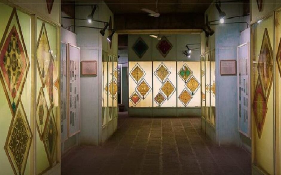 Exhibits of kites in display cases at the Paldi Kite Museum, Gujarat