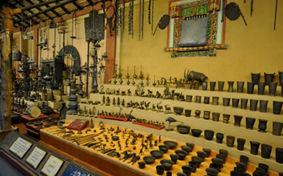 Display of various kitchen utensils on a large display unit at the The Veechar Cultural and Heritage Museum for Utensils, Ahmedabad