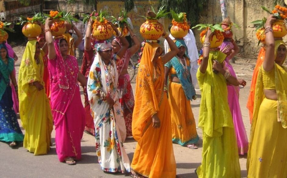 Women in brightly coloured sarees at Gangaur Festival, Rajasthan