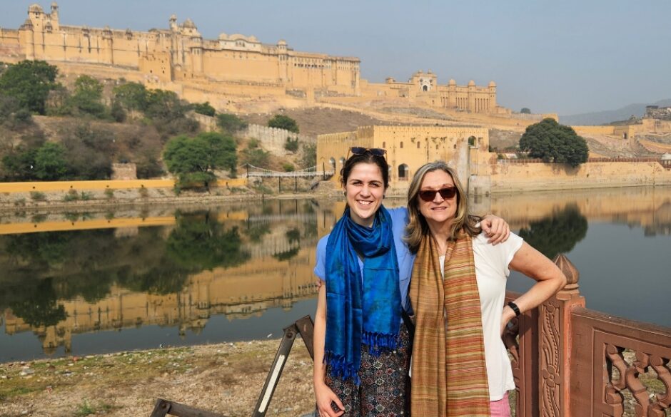 Jocelyn and her travelling companion standing in front of Amber Fort in Jaipur on their Golden Triangle Tour