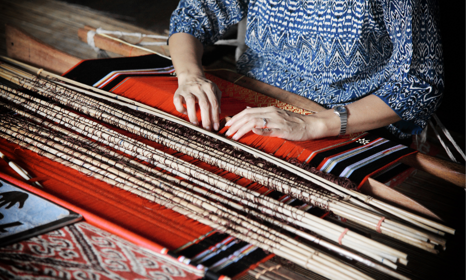 Woman hand-loom weaving