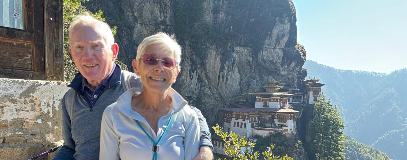 John and Irene's North India and Bhutan tailored tour - John and Irene with Tiger's Nest Monastery in the background