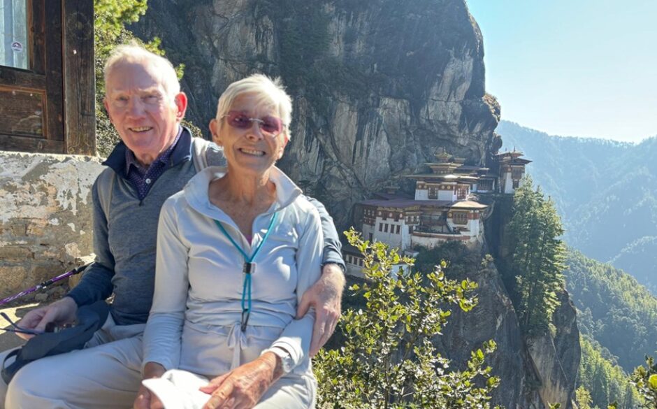 John and Irene's North India and Bhutan tailored tour - John and Irene with Tiger's Nest Monastery in the background