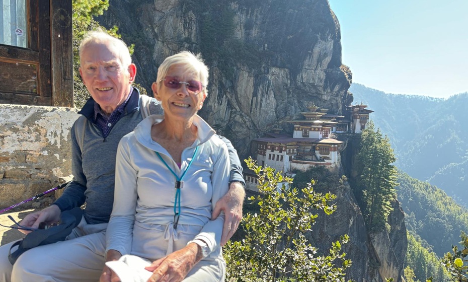 John and Irene's North India and Bhutan tailored tour - John and Irene with Tiger's Nest Monastery in the background