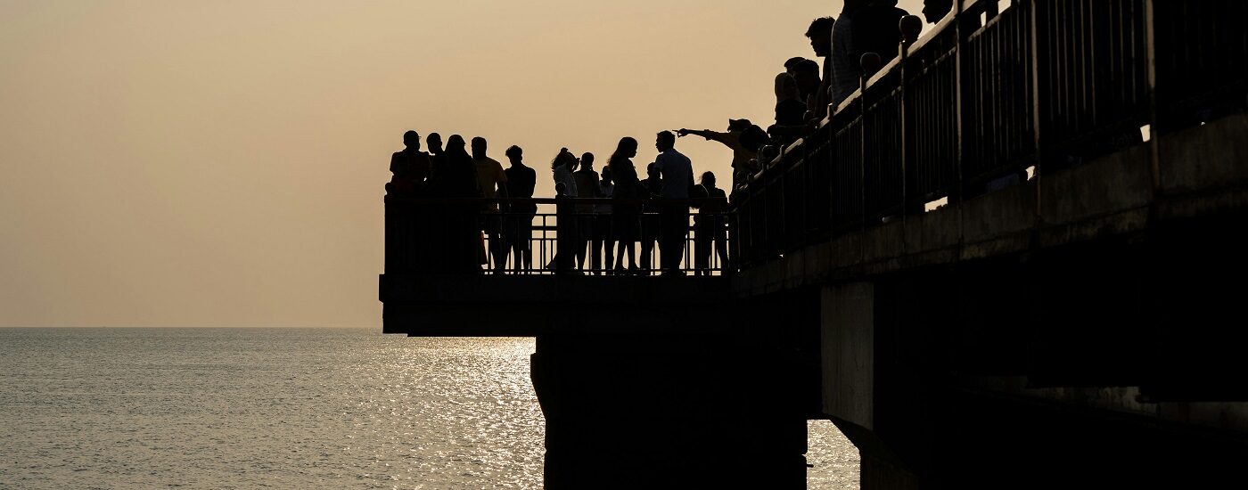 Things to see in Sri Lanka - silhouetted people on the pier