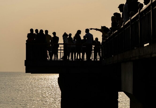 Things to see in Sri Lanka - silhouetted people on the pier