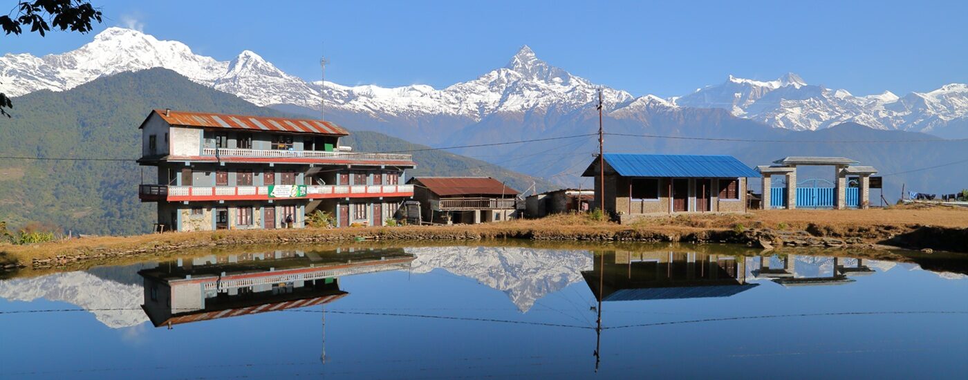 Dhampus,,Nepal:,Reflections,Of,Himalaya,Mountains,(machapuchare,Peak),And,Houses