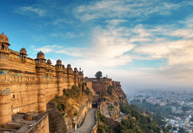 Visit Gwalior to see the stunning Gwalior Fort (pictured in this image)
